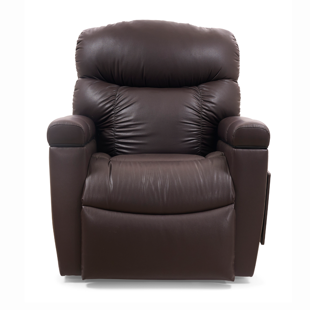 Against a plain white background, the Golden Cloud+ PR511 Recliner with Lift Assist in plush brown leather is displayed, featuring overstuffed cushions, padded armrests, and a cozy 4-Zone Comfort Zone. The AutoDrive hand control enhances comfort and relaxation.